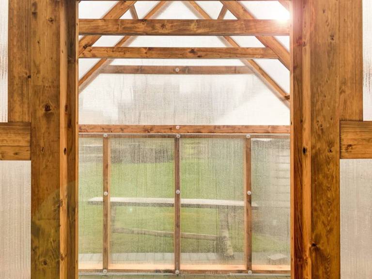 inside of wooden greenhouse